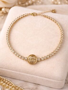 Gold Crystal Tennis Necklace with Logo Medallion Accent
